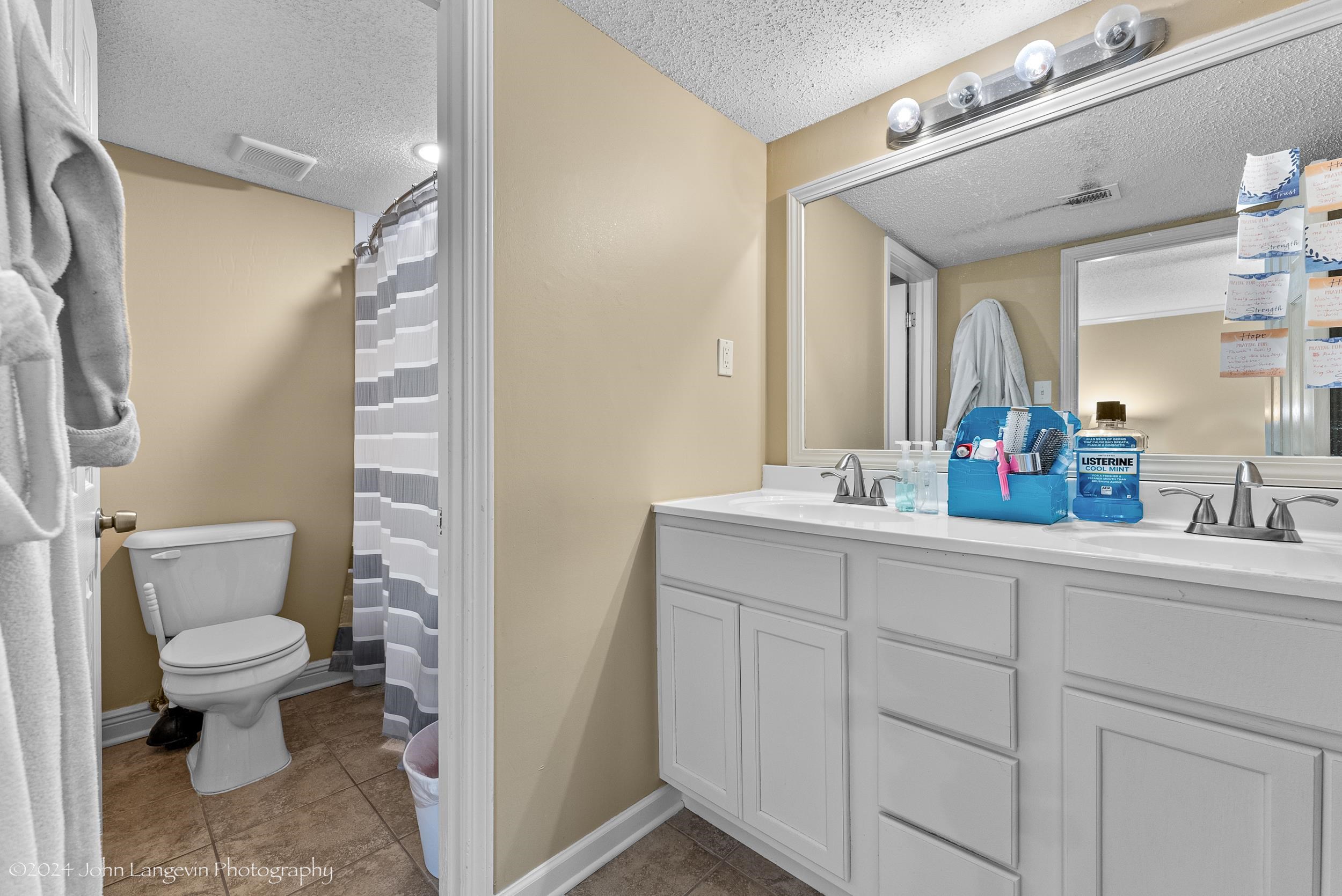 3118 Knob Hill Road Lakeland, TN 38002 - Photo 15 of 27 Bathroom featuring tile floors, oversized vanity, toilet, and double sink
