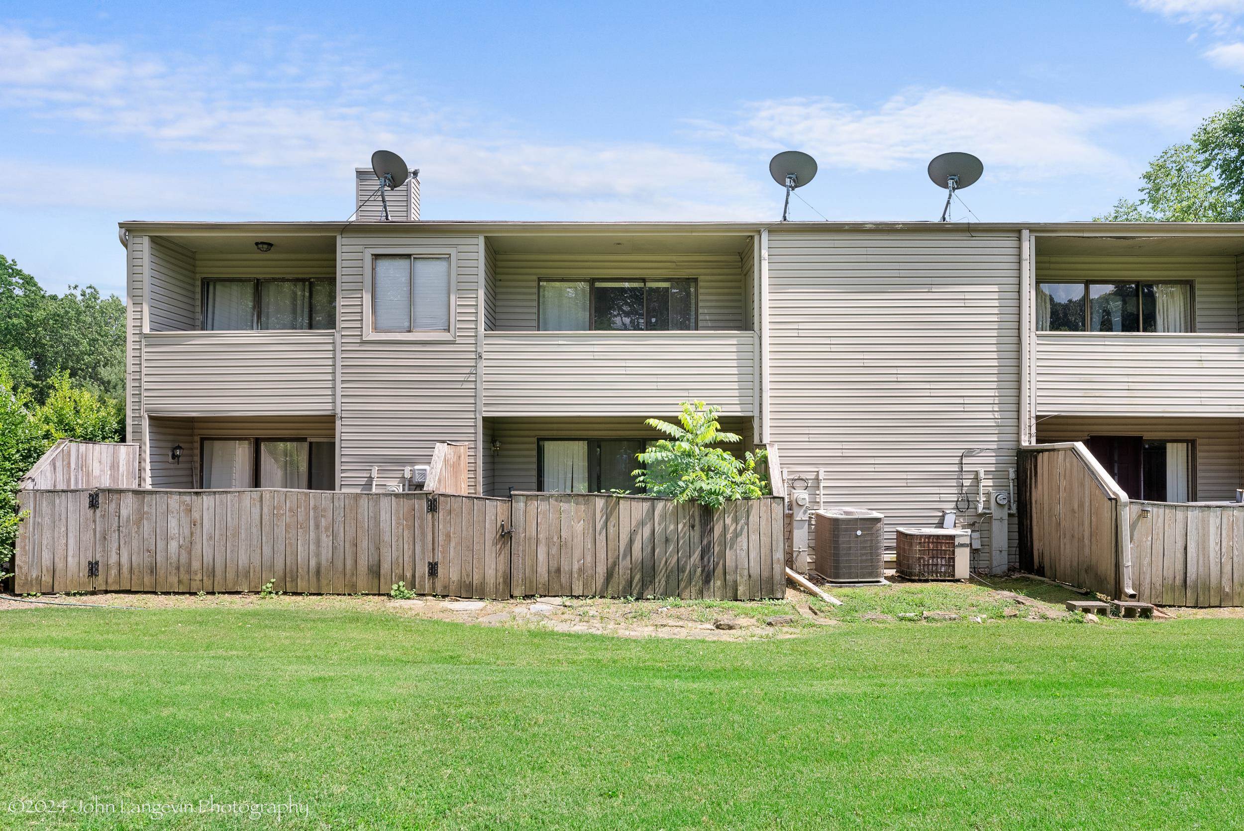 3118 Knob Hill Road Lakeland, TN 38002 - Photo 27 of 27 Rear view of house with a yard and central AC unit