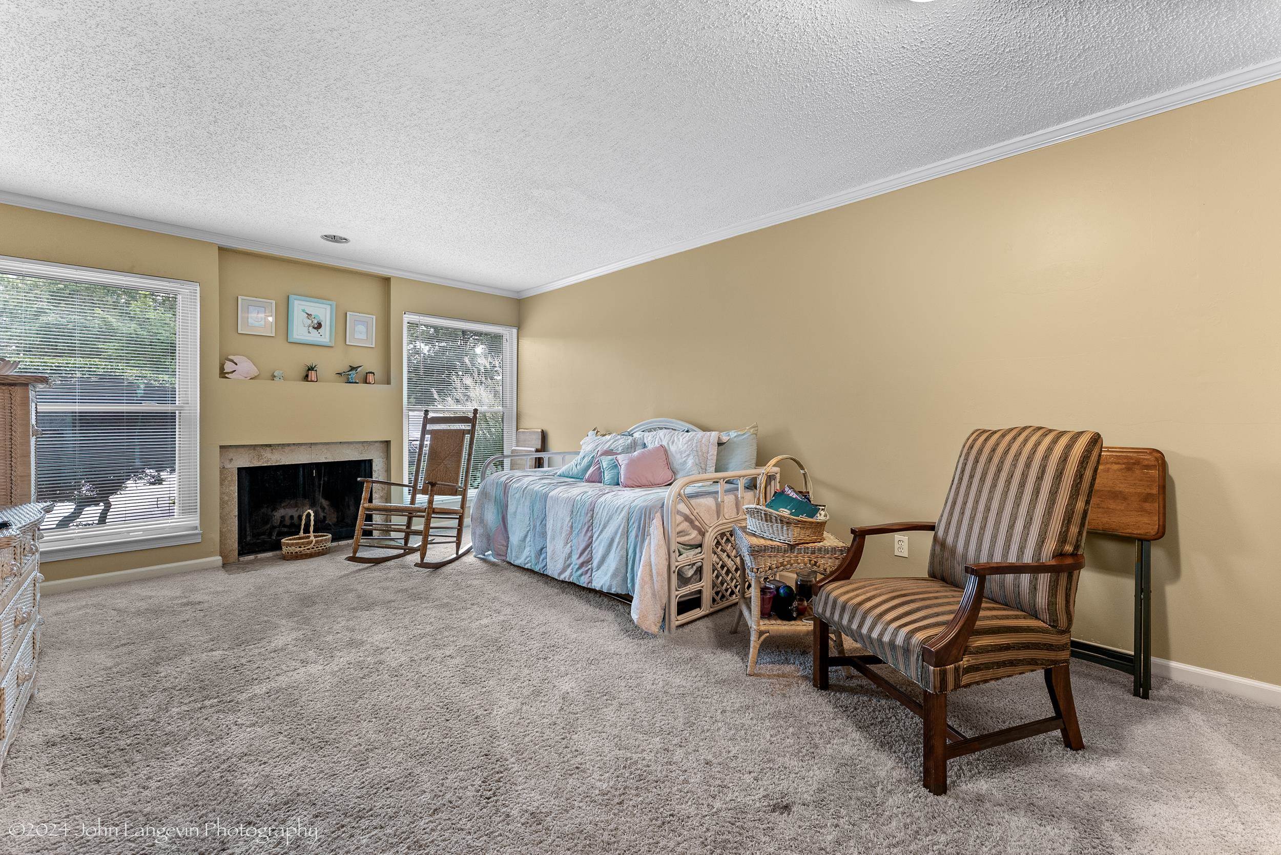 3118 Knob Hill Road Lakeland, TN 38002 - Photo 5 of 27 Carpeted bedroom with crown molding, a high end fireplace, and a textured ceiling