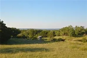 a view of lake with green space