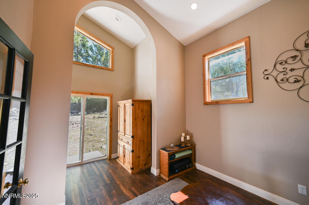 1147 Autumn Hills Road Gardnerville, NV 89460 - Photo 11 of 53 an empty room with wooden floor and windows