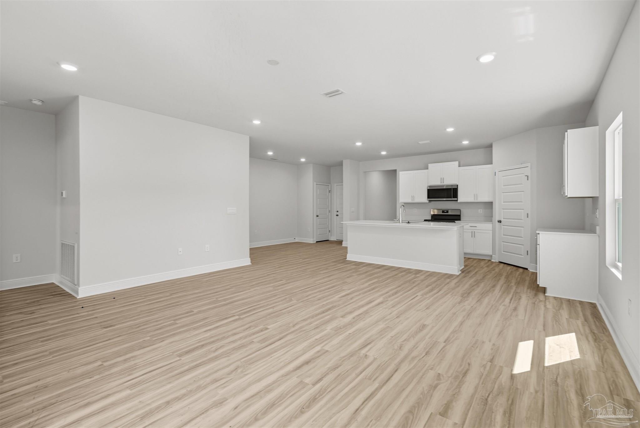 2808 Water Birch Road Cantonment, FL 32533 - Photo 27 of 41 a view of kitchen with cabinets and wooden floor