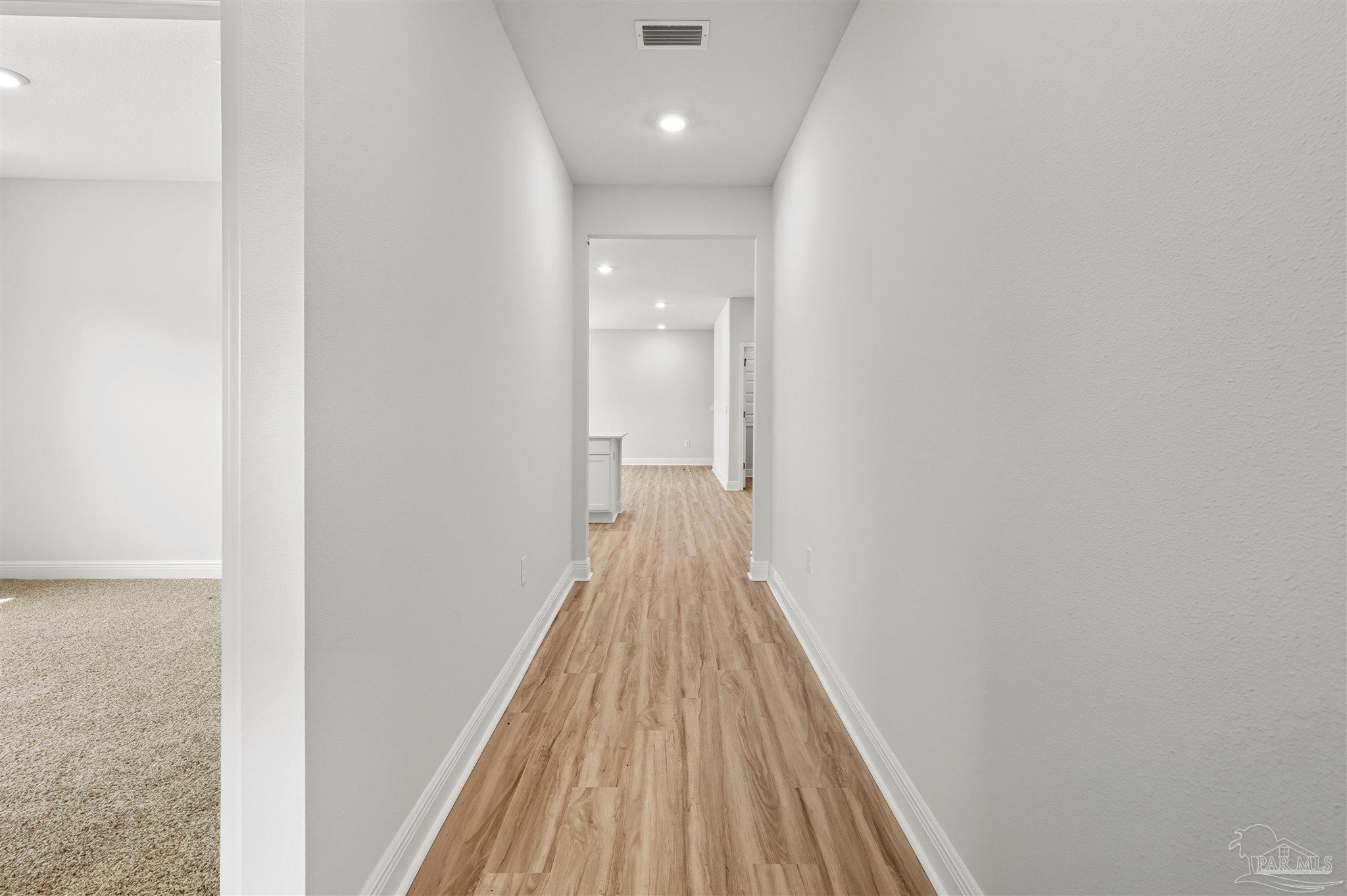 2808 Water Birch Road Cantonment, FL 32533 - Photo 5 of 41 a view of a hallway with wooden floor and staircase