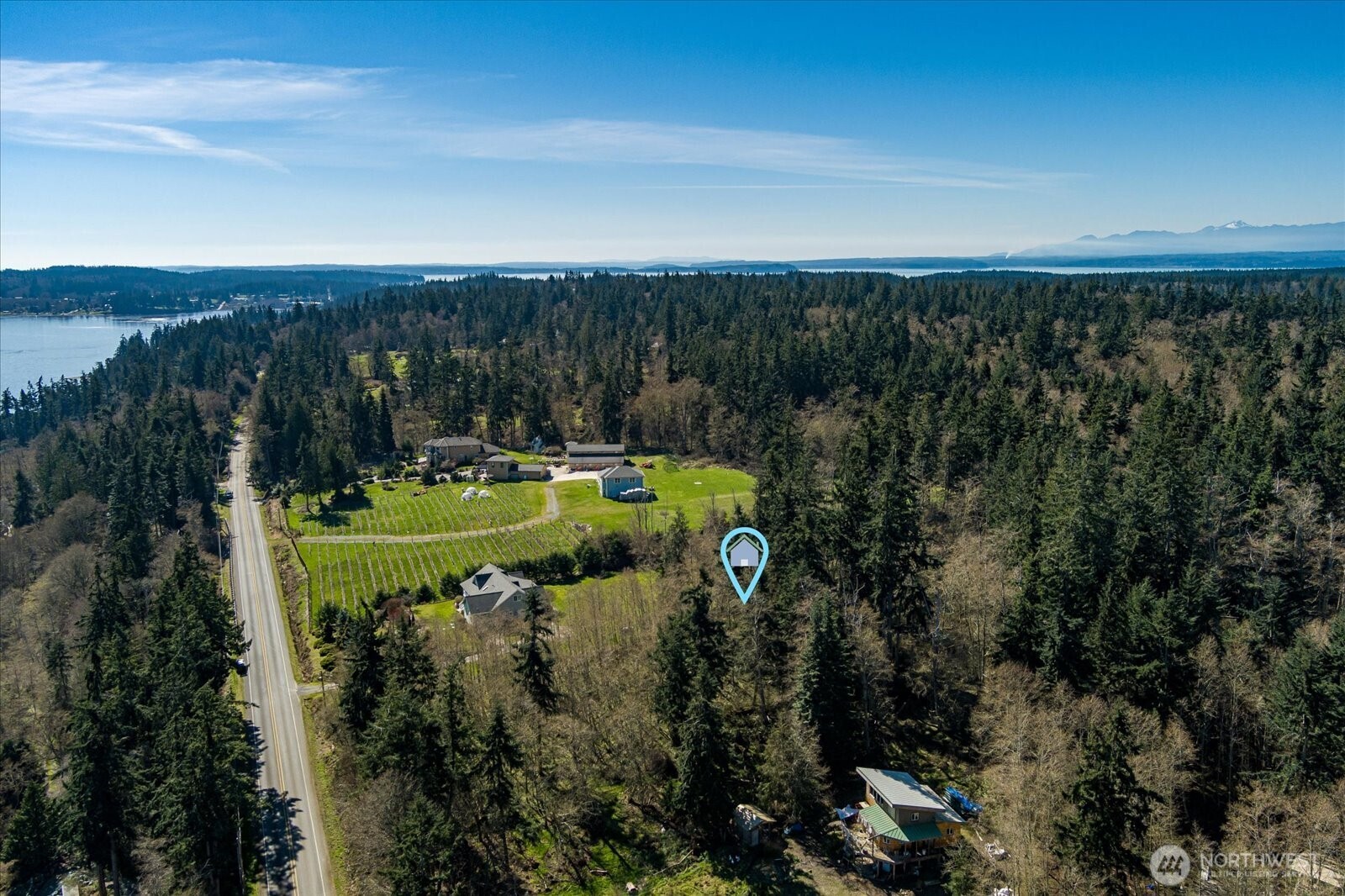0 South Honeymoon Bay Road Greenbank, WA 98253 - Photo 7 of 12 a view of a golf course with a lake