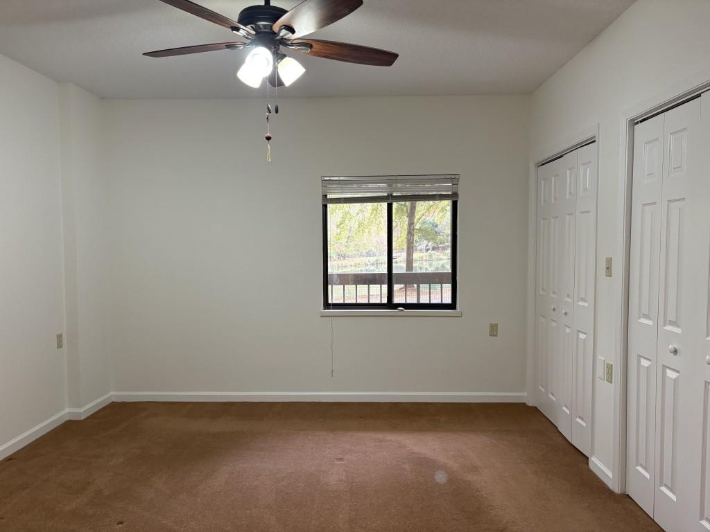 1800 Clairmont Lake, Unit 124 Decatur, GA 30033 - Photo 13 of 22 an empty room with a window and a fan