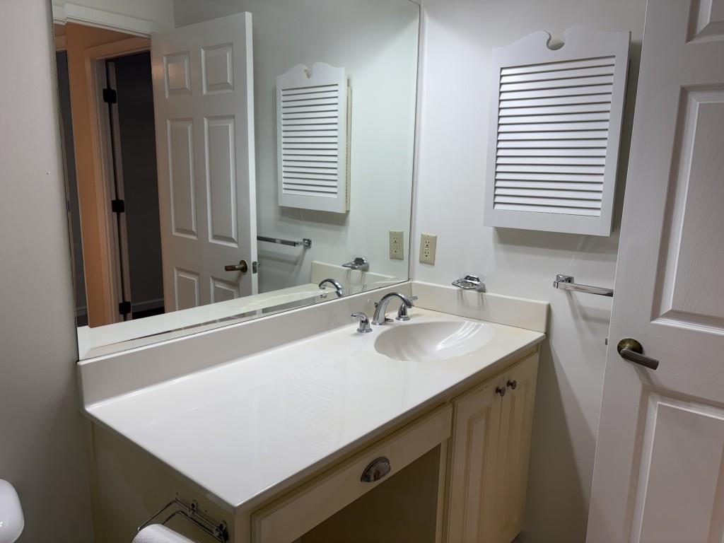 1800 Clairmont Lake, Unit 124 Decatur, GA 30033 - Photo 16 of 22 a bathroom with a sink and a mirror