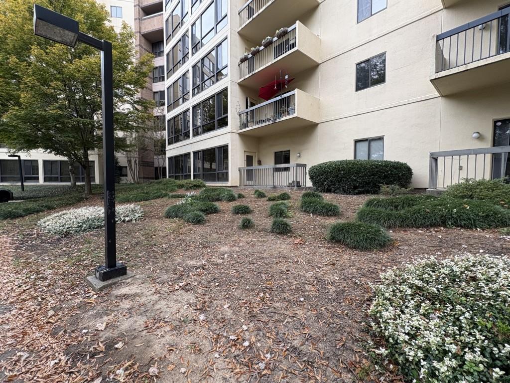 1800 Clairmont Lake, Unit 124 Decatur, GA 30033 - Photo 20 of 22 a view of a building with a yard