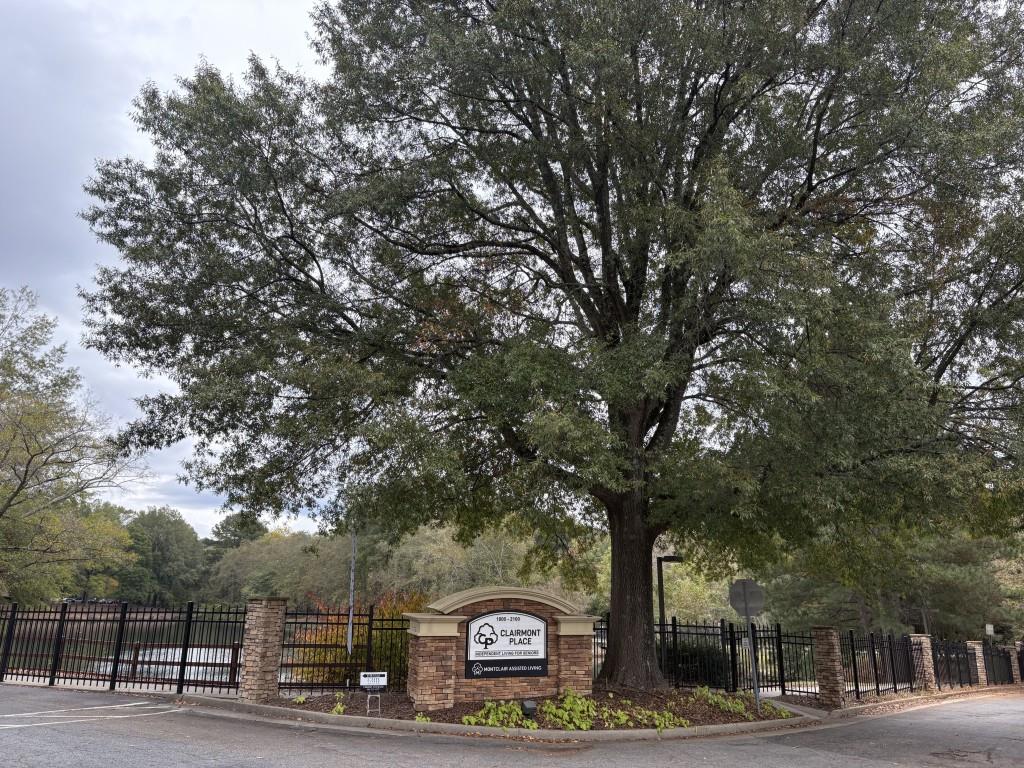1800 Clairmont Lake, Unit 124 Decatur, GA 30033 - Photo 2 of 22 a sign board with large trees
