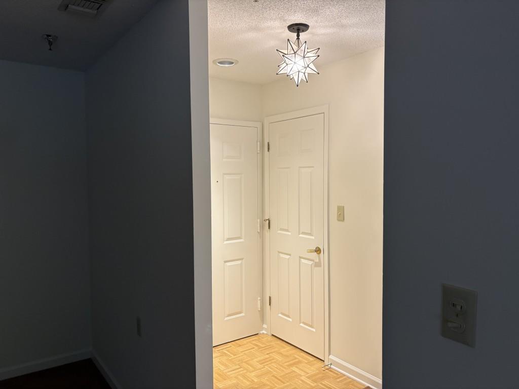 1800 Clairmont Lake, Unit 124 Decatur, GA 30033 - Photo 5 of 22 a view of a hallway with wooden floor