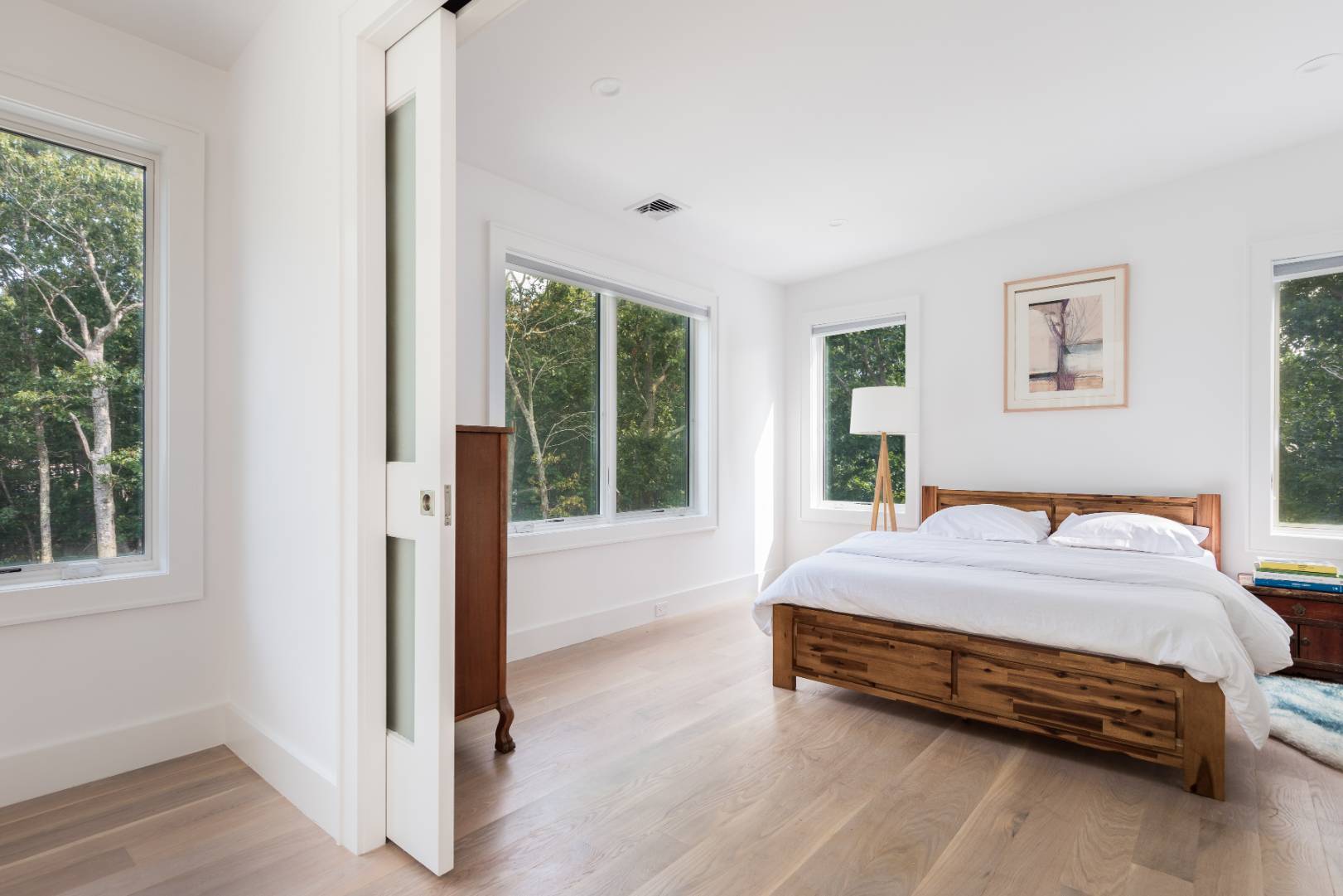 6 Landfall Circle East Hampton, NY 11937 - Photo 11 of 26 a bedroom with a bed and a large window