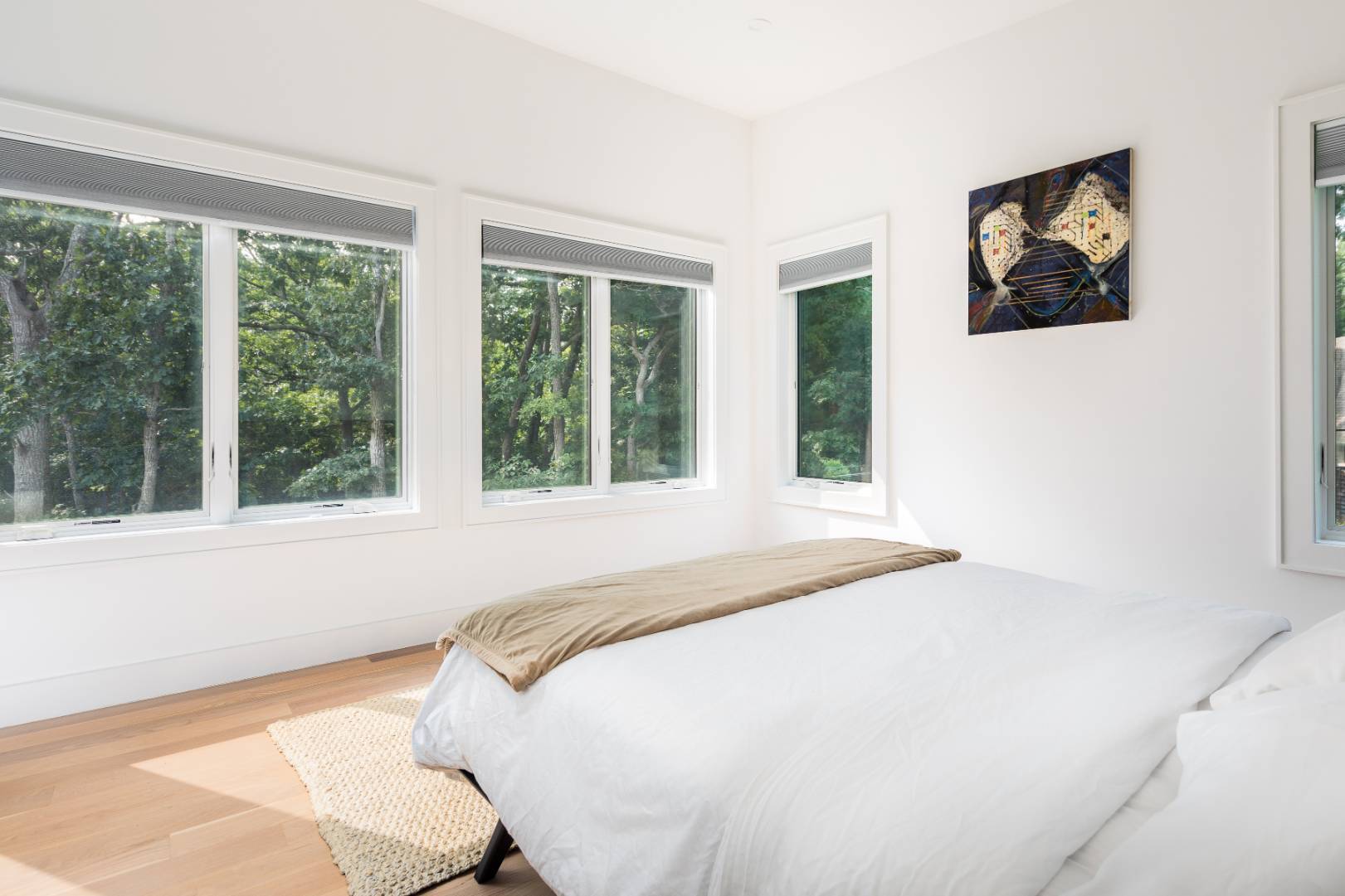 6 Landfall Circle East Hampton, NY 11937 - Photo 13 of 26 a bedroom with a bed and a large window