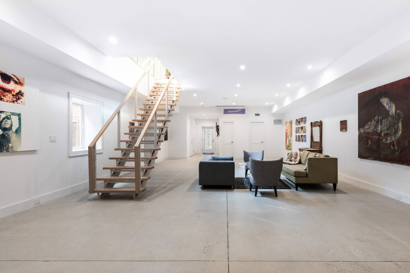 6 Landfall Circle East Hampton, NY 11937 - Photo 18 of 26 a living room with furniture and stairs
