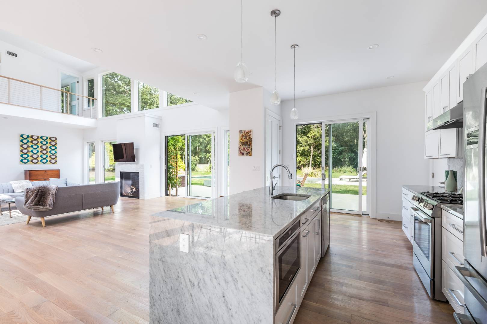 6 Landfall Circle East Hampton, NY 11937 - Photo 5 of 26 a large kitchen with a large window a sink and stainless steel appliances