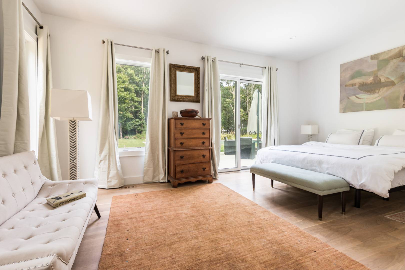 6 Landfall Circle East Hampton, NY 11937 - Photo 8 of 26 a bedroom with a bed and a large window