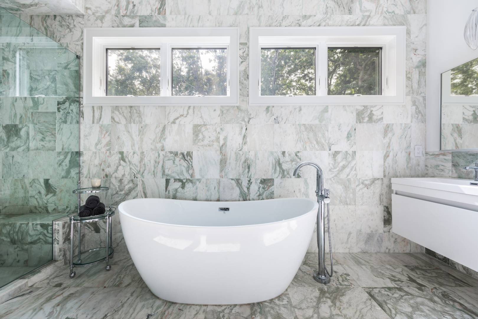 6 Landfall Circle East Hampton, NY 11937 - Photo 9 of 26 a white bath tub sitting next to a white sink
