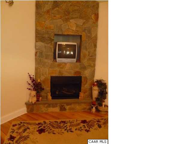 23 Stonefield Road Palmyra, VA 22963 - Photo 15 of 32 a living room with a fireplace