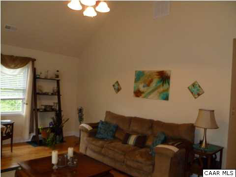 23 Stonefield Road Palmyra, VA 22963 - Photo 18 of 32 a living room with furniture and a window