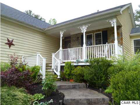 23 Stonefield Road Palmyra, VA 22963 - Photo 2 of 32 a front view of a house with a garden