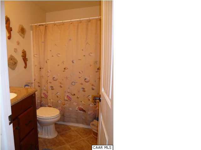 23 Stonefield Road Palmyra, VA 22963 - Photo 22 of 32 a bathroom with a toilet and a shower