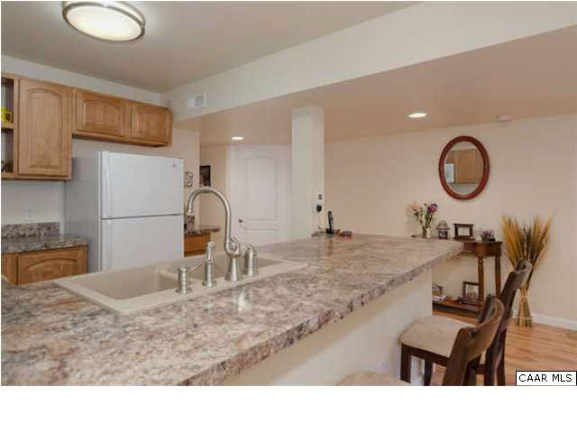 23 Stonefield Road Palmyra, VA 22963 - Photo 24 of 32 a kitchen with a table chairs and a sink