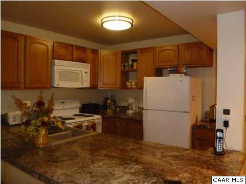 23 Stonefield Road Palmyra, VA 22963 - Photo 25 of 32 a kitchen with a refrigerator and a stove top oven