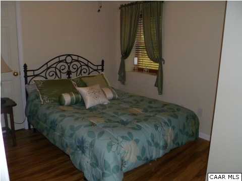 23 Stonefield Road Palmyra, VA 22963 - Photo 29 of 32 a bed sitting in a bedroom next to a window