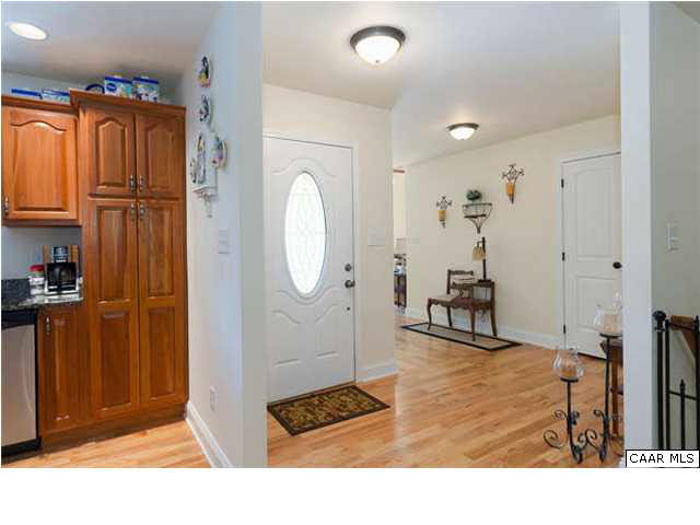 23 Stonefield Road Palmyra, VA 22963 - Photo 9 of 32 a room with lots of white furniture and a rug