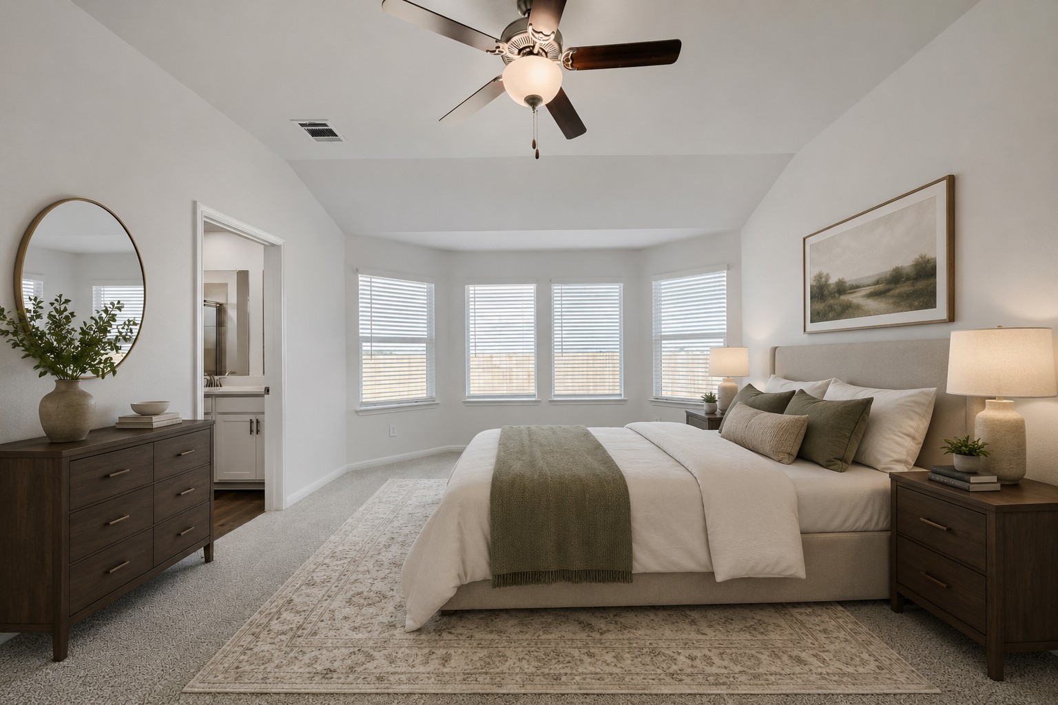 146 Diablo Rim Terrace Dripping Springs, TX 78620 - Photo 3 of 32 A spacious primary bedroom features a bay window with ample natural light and direct access to a private bathroom.