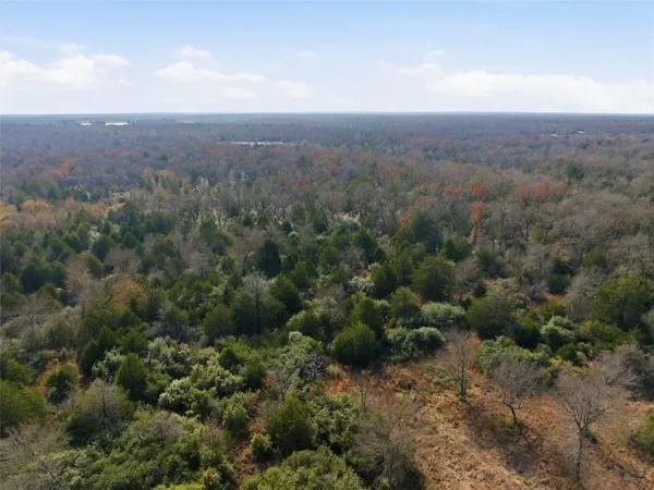 an aerial view of house with yard