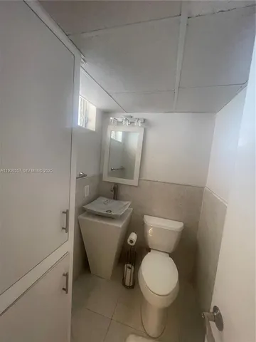 a lobby with furniture and a chandelier