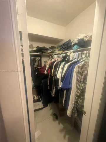 a room with furniture and a floor to ceiling window