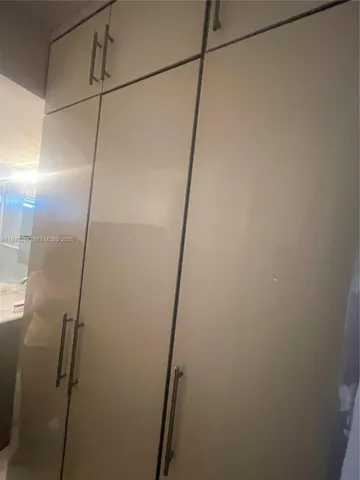 a lobby with furniture and chandelier