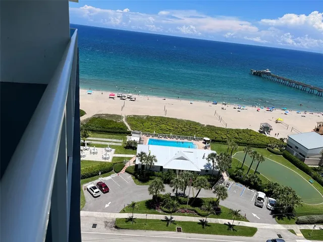 a view of a swimming pool with a yard