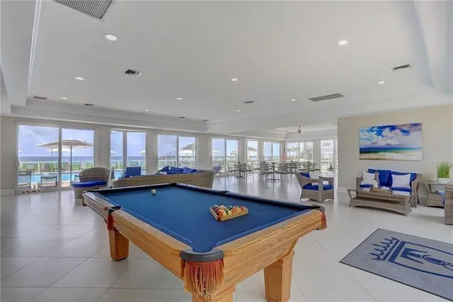 a room with furniture and pool table