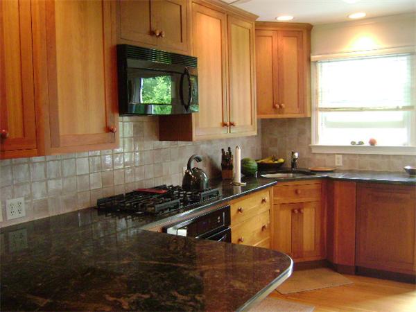 44 Sevinor Road Marblehead, MA 01945 - Photo 7 of 17 a kitchen with stainless steel appliances a stove a sink cabinets and a window