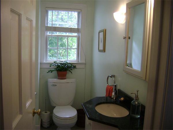 44 Sevinor Road Marblehead, MA 01945 - Photo 10 of 17 a bathroom with a toilet sink and mirror