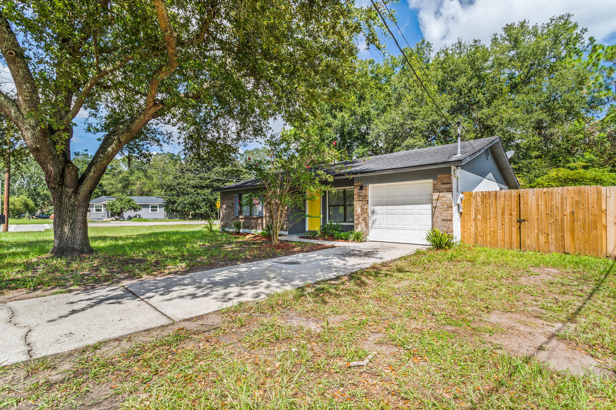 a house with trees in front of it