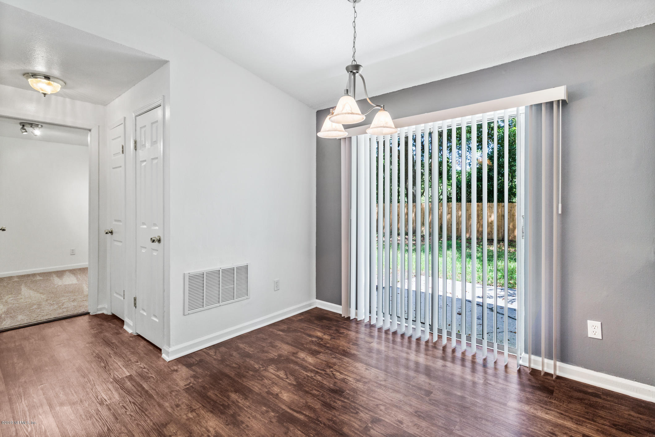 7163 Melvin Road Jacksonville, FL 32210 - Photo 17 of 33 a view of entryway with wooden floor