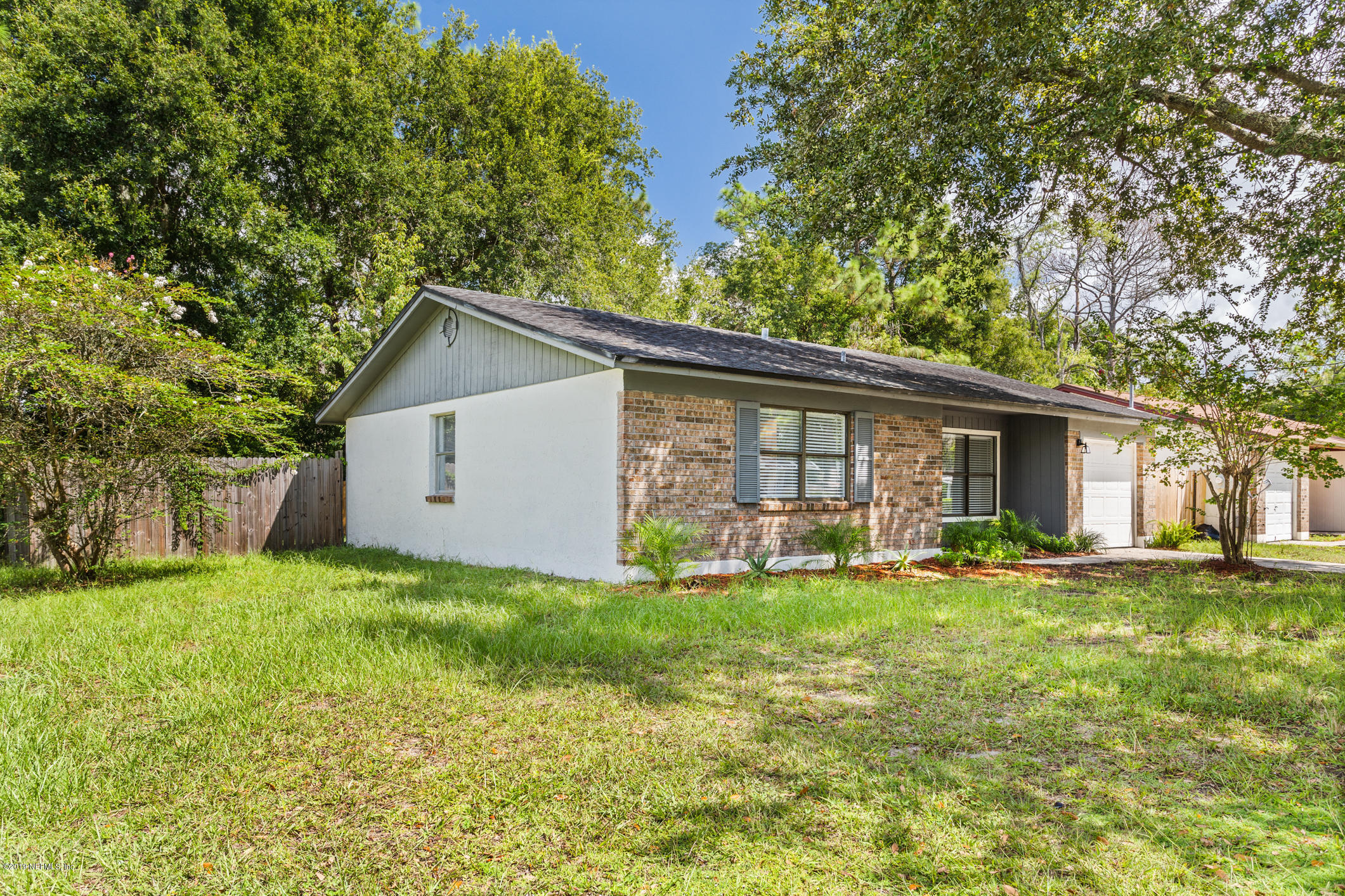 7163 Melvin Road Jacksonville, FL 32210 - Photo 2 of 33 a view of a house with a yard