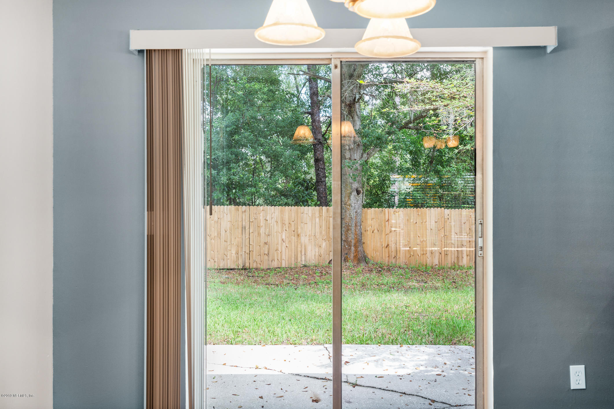 7163 Melvin Road Jacksonville, FL 32210 - Photo 28 of 33 a window in an empty room