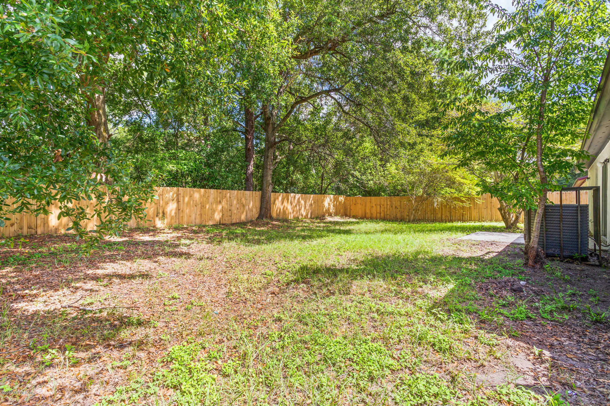 7163 Melvin Road Jacksonville, FL 32210 - Photo 29 of 33 a view of a yard with a tree