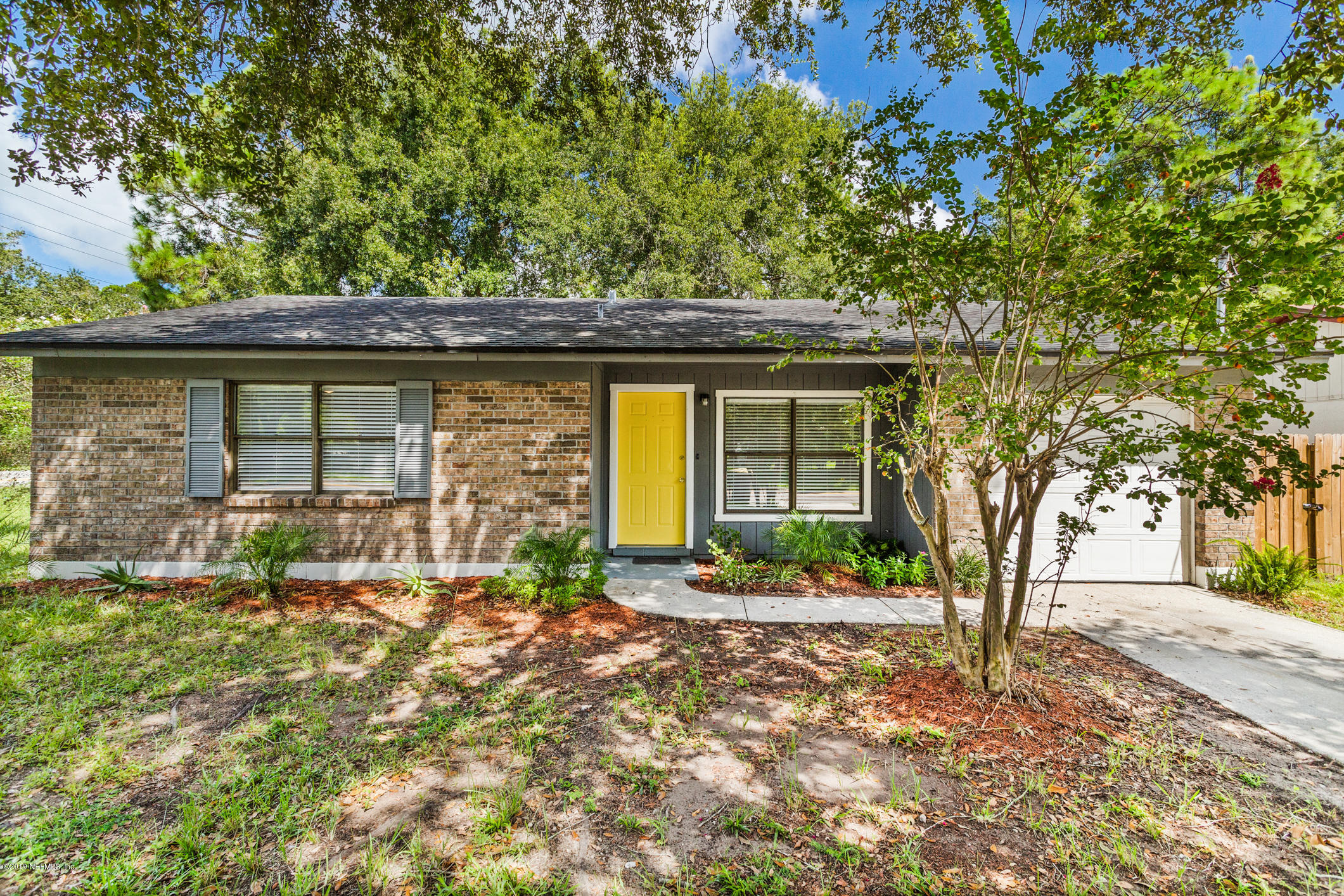 7163 Melvin Road Jacksonville, FL 32210 - Photo 4 of 33 a front view of a house with garden