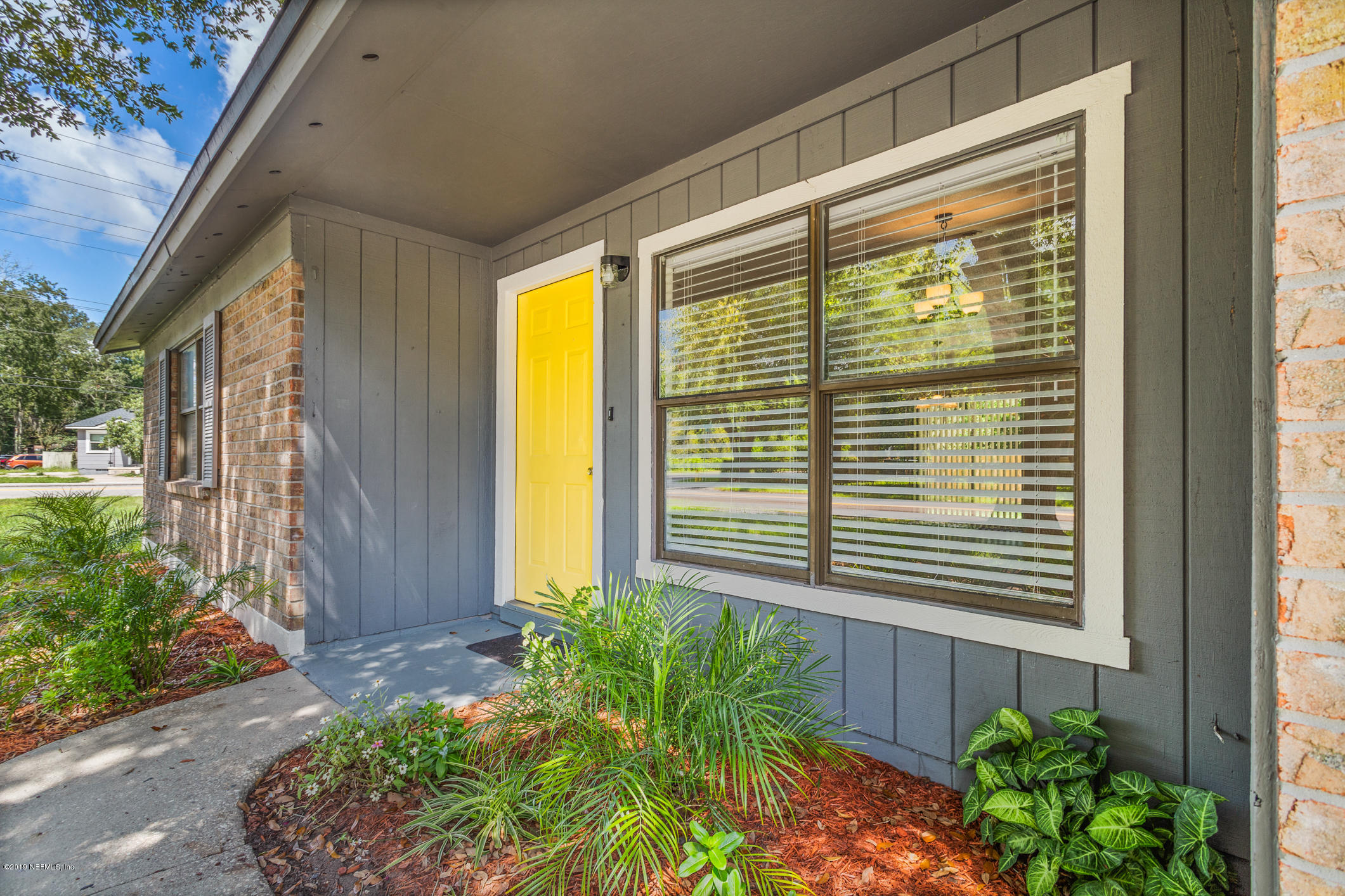 7163 Melvin Road Jacksonville, FL 32210 - Photo 7 of 33 a view of a house with a backyard