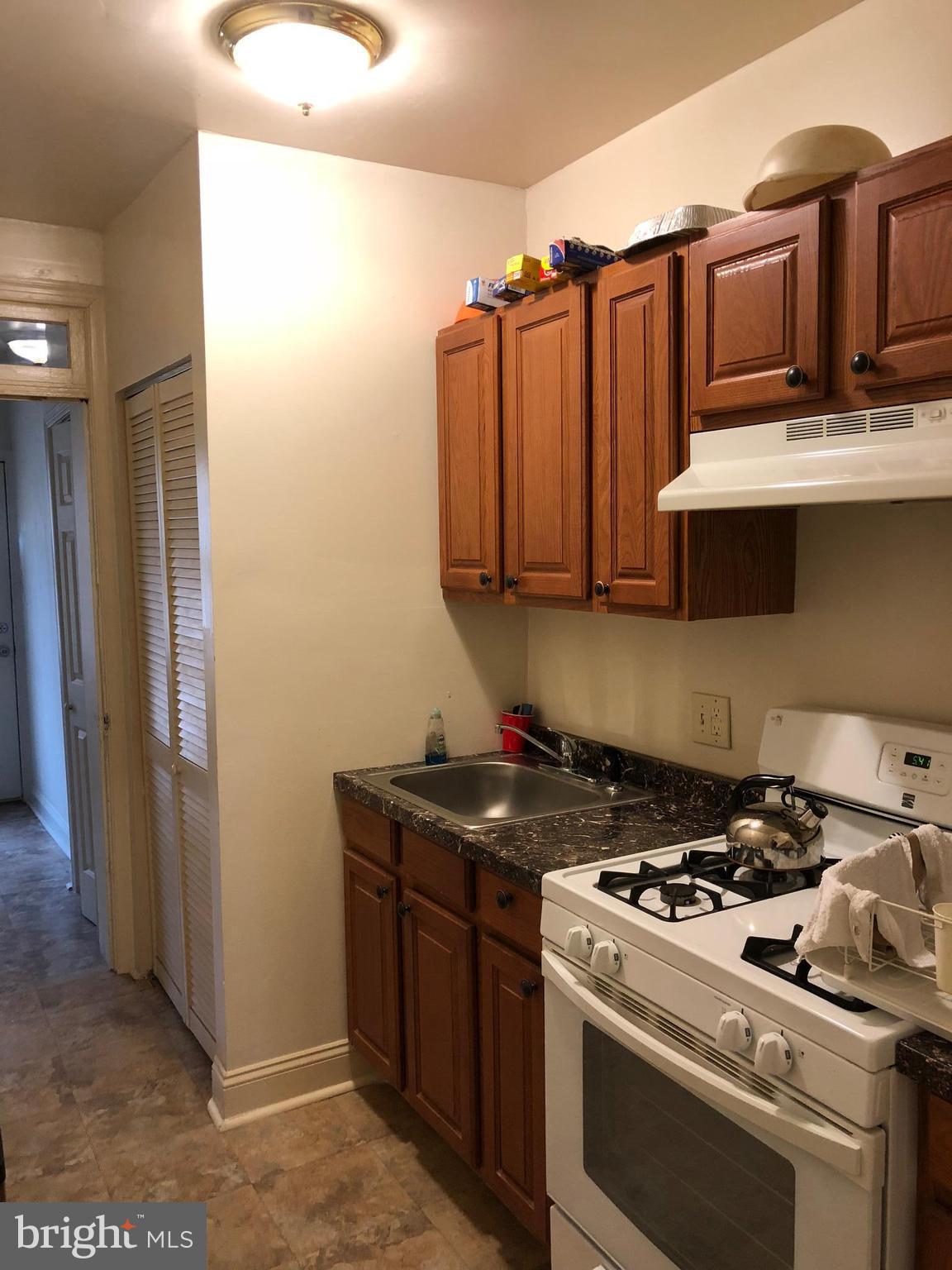 3011 9th Street Southeast Washington, DC 20032 - Photo 6 of 6 a kitchen with stainless steel appliances granite countertop a stove and a sink