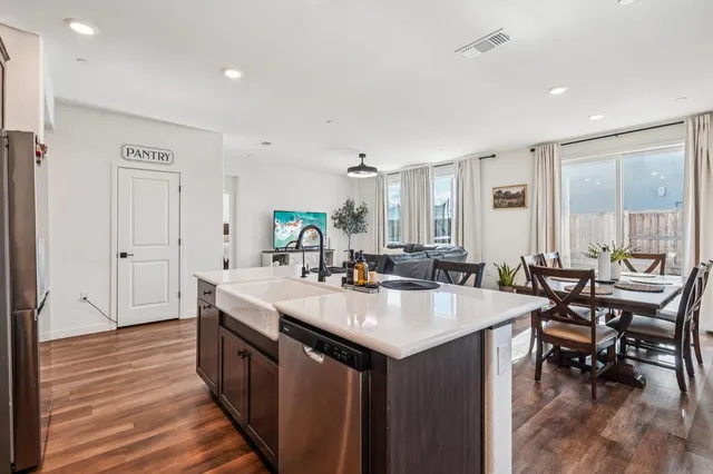 a view of kitchen island wooden floor
