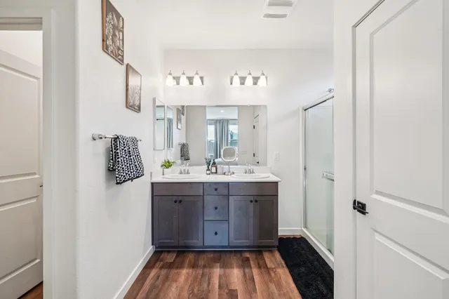 a room with a sink and a mirror