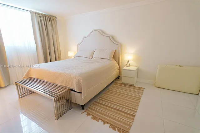 a bedroom with a bed and a mirror