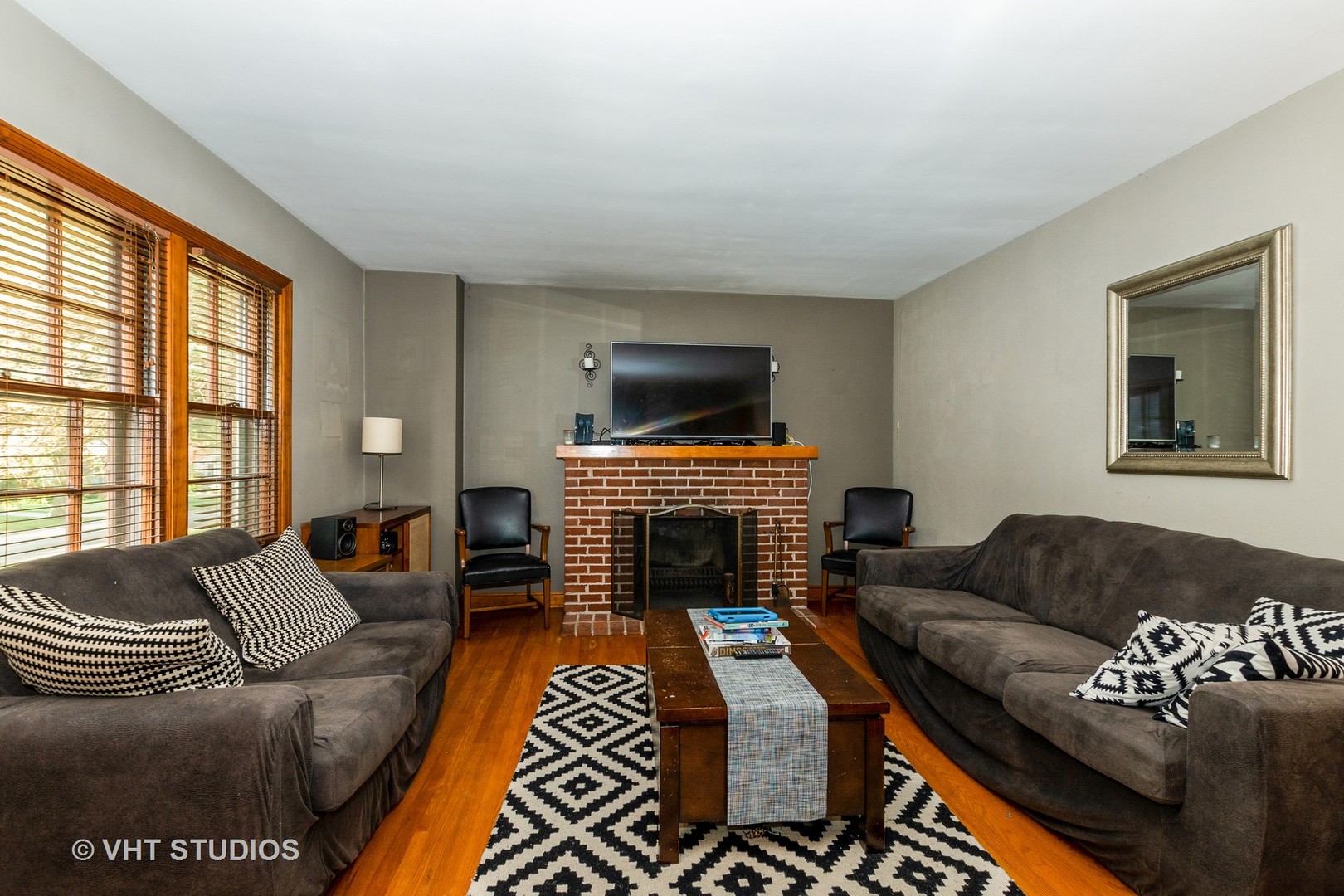 1825 Evergreen Road Homewood, IL 60430 - Photo 2 of 12 a living room with furniture a fireplace and a large window