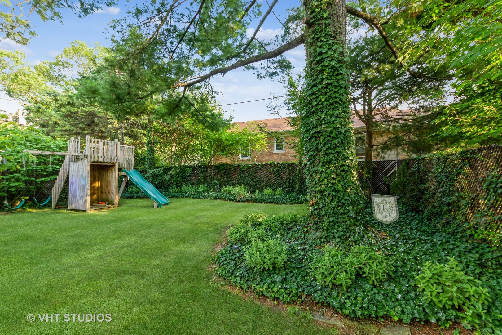 1825 Evergreen Road Homewood, IL 60430 - Photo 11 of 12 a view of a house with a backyard and a tree