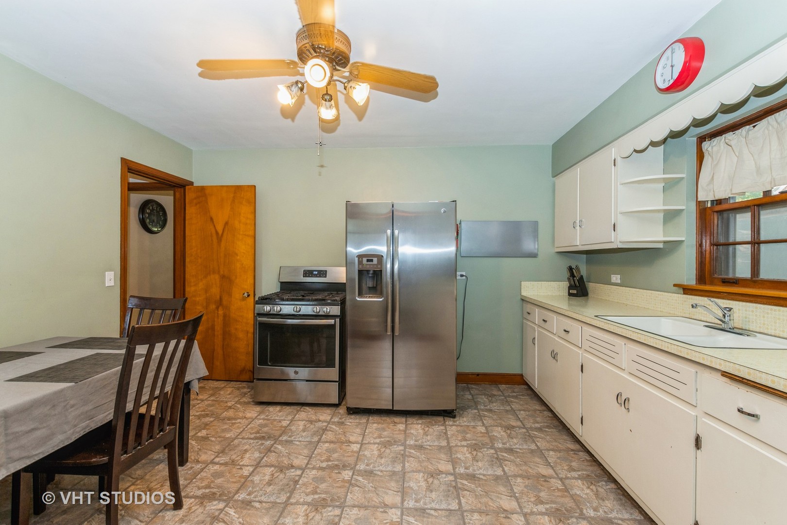 1825 Evergreen Road Homewood, IL 60430 - Photo 3 of 12 a kitchen with stainless steel appliances granite countertop a sink and a refrigerator